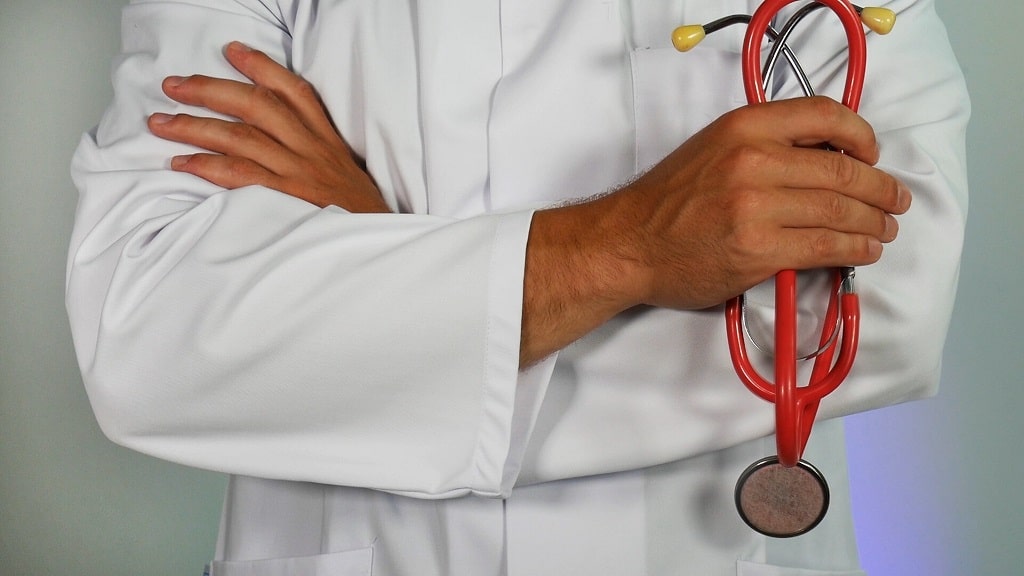 doctor with stethoscope arms crossed