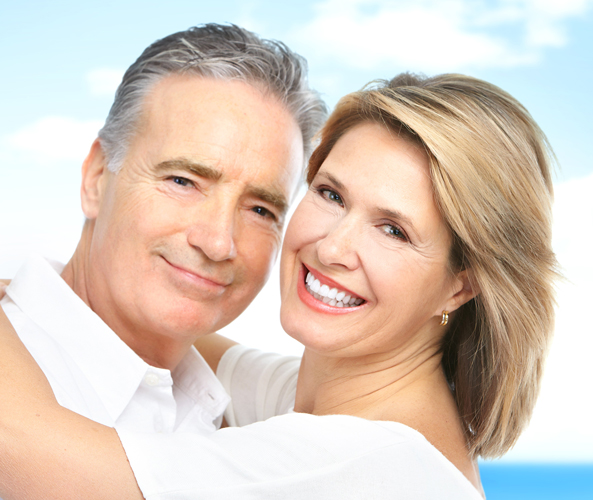 man and woman smiling