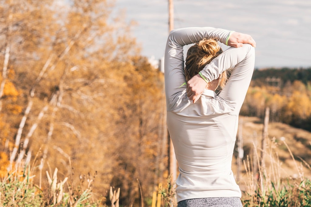 woman stretching showing upper body contours