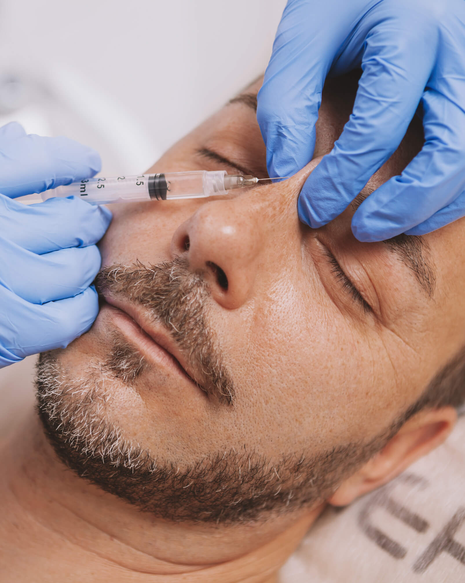 Man getting liquid rhinoplasty